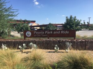 Sign for Peoria Park and Ride with a clear blue sky.